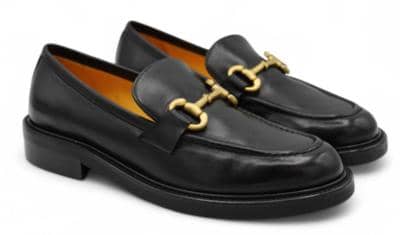 Black Italian leather loafers with gold hardware for resellers