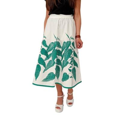 Saia branca italiana com estampa de folhas verdes para revendedores
