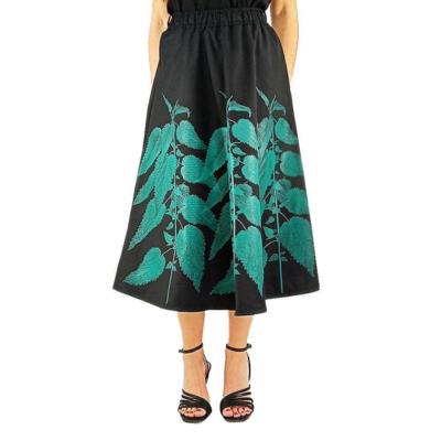 Saia midi preta com estampa de folhas turquesa Made in Italy para revendedores