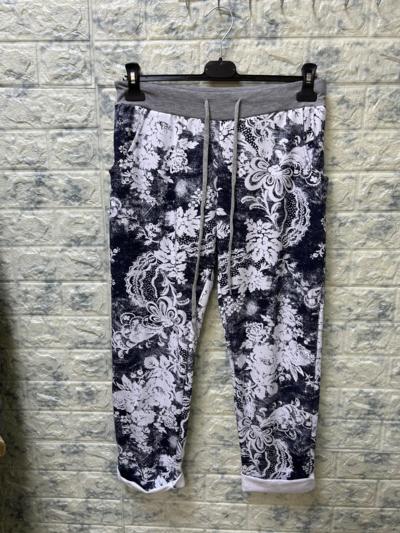 Pantalones deportivos florales, fabricados en Italia para revendedores.