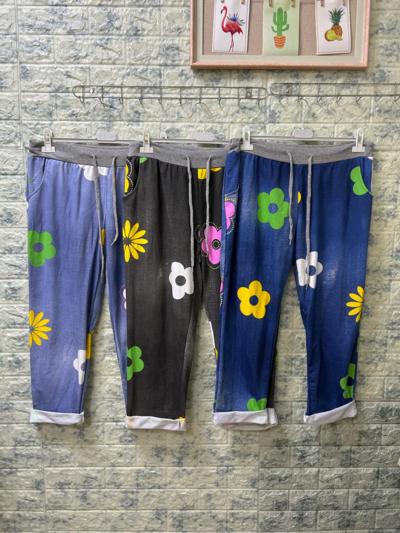 Pantalones florales coloridos, Hecho en Italia, para revendedores.